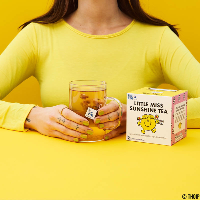 little miss sunshine tea cube holding hot tea